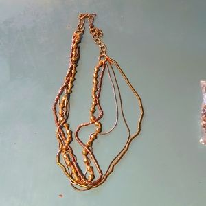 Statement necklace in gold, copper and brown